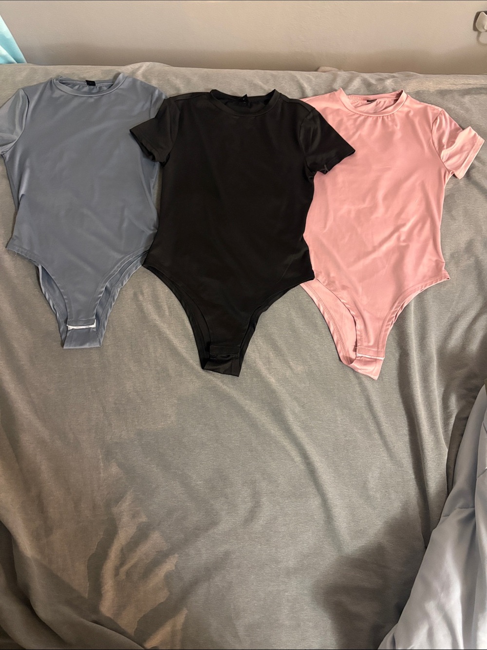 Women’s Short Sleeve One-Piece Bodysuit in Black, Pink, and Blue